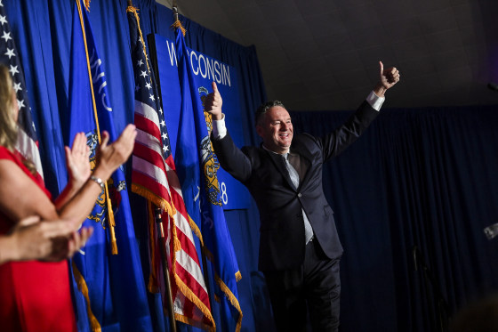 Image: Republican candidate for Wisconsin governor Tim Michels gives the thumbs up during his victory primary election night event on August 9, 2022 in Waukesha, Wisconsin.