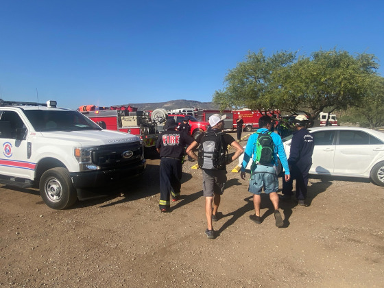 Emergency personnel work at a rescue site at the Spur Cross Trailhead Mountain