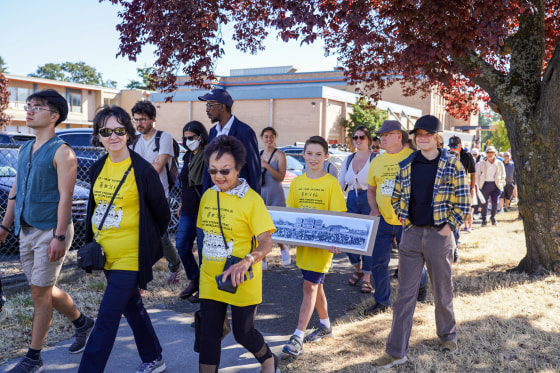People march to commemorate the centennial of the Chinese community's pushback against segregation in Victoria, Canada, on Sept. 5, 2022.