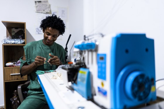 Esteban Sinisterra Paz, creator of Esteban Africa, works in his workshop in his apartment in Cali, Colombia, on July 6, 2022.