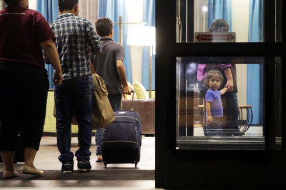 Immigrants seeking asylum who were recently reunited arrive at a hotel in San Antonio on July 23, 2018.