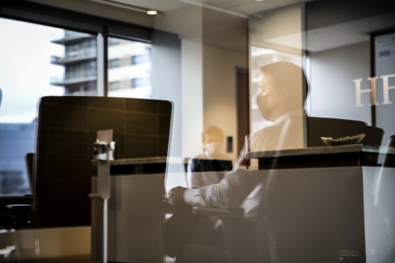 Employees in a conference room at an office in Dallas on Sept. 9, 2020.