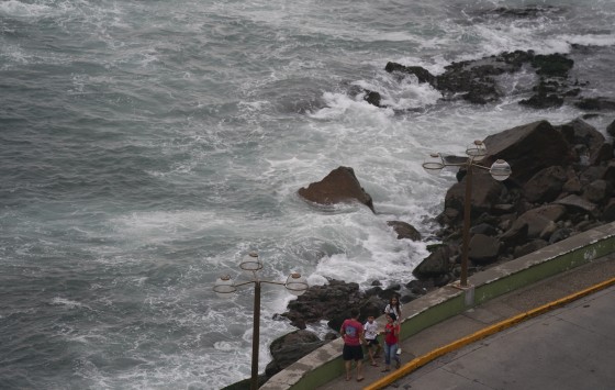 People relax at the shore in Mazatlán, Mexico, on Sunday. Hurricane Orlene is heading for Mexico's northwest Pacific coast between the tourist towns of Mazatlán and San Blas.