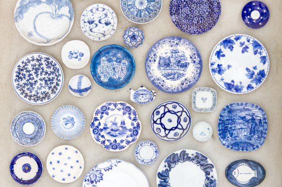 Porcelain plates placed on the cement floor for background.