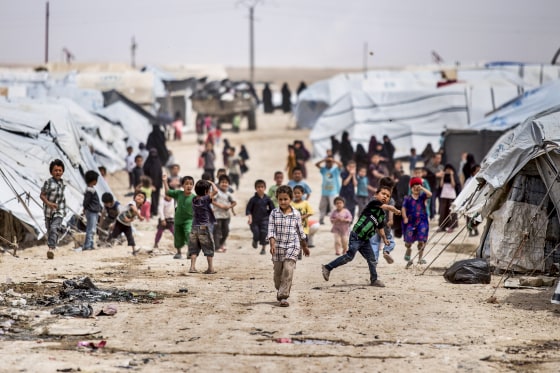 Children gather outside their tents, at al-Hol camp, which houses families of members of the Islamic State group, in Hasakeh province, Syria, on May 1, 2021.