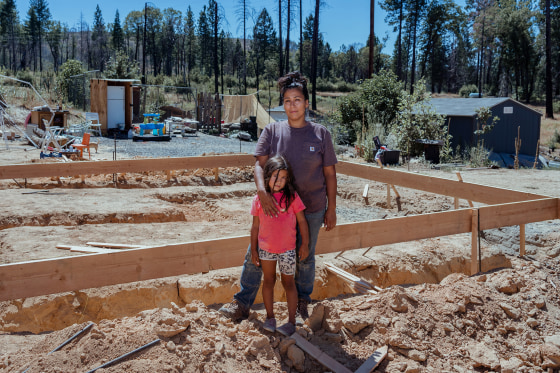 Inez Salinas and her daughter, River, at the site of their new house in Concow, Calif., on Sept. 1, 2022.