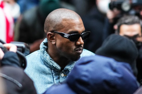 Ye walks through paparazzi during Paris Fashion Week