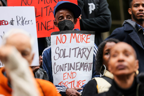People protest outside City Hall over conditions on Rikers Island on Oct. 25, 2022, in New York.