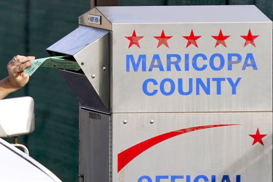 A voter casts their ballot at a secure ballot drop box at the Maricopa County Tabulation and Election Center in Phoenix, Tuesday, Nov. 1, 2022.