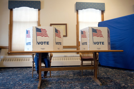 A lone voter cast her ballot at the Summit County Historic Courthouse in Breckenridge, Colorado on November 6, 2018. - Americans started voting Tuesday in critical midterm elections that mark the first major voter test of Donald Trump's presidency, with control of Congress at stake.