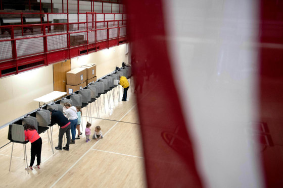 Voters cast their ballots at East High School in Denver on Nov. 8, 2022.