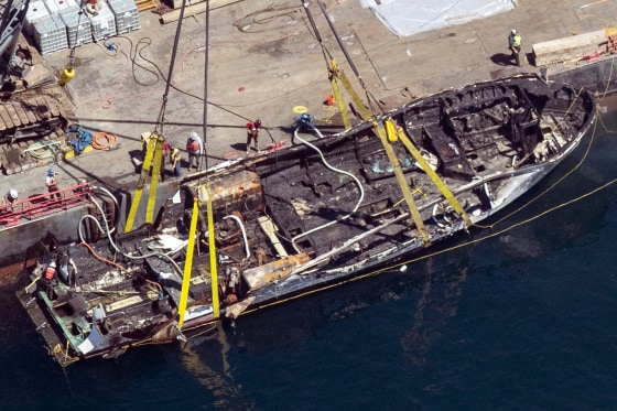 The burned hull of the Conception is brought to the surface off Santa Cruz Island, Calif on Sept. 12, 2019.