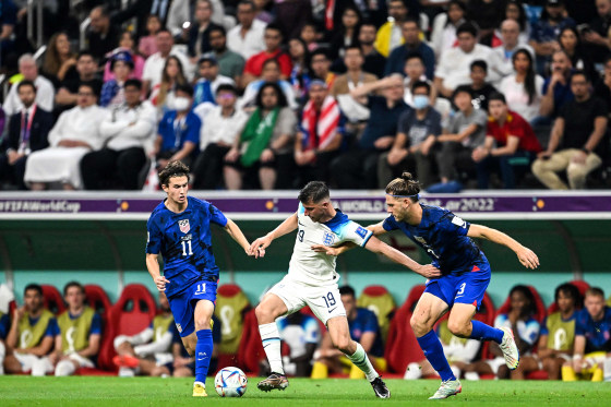 England's midfielder #19 Mason Mount fights for the ball with USA's midfielder #11 Brenden Aaronson and USA's defender #03 Walker Zimmerman during the Qatar 2022 World Cup Group B football match between England and USA at the Al-Bayt Stadium in Al Khor, north of Doha on Nov. 25, 2022.