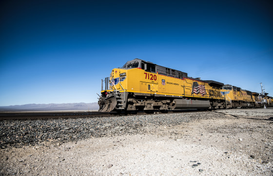 A Union Pacific freight train passes the railroad crossing in Nipton, Calif., on Aug. 30, 2019.