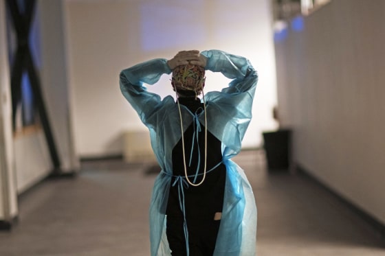 Registered traveling nurse Patricia Carrete of El Paso, Texas, during a night shift at a field hospital set up to handle a surge of Covid patients on Feb. 10, 2021, in Cranston, R.I.