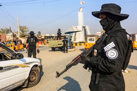 A member of the Taliban security forces stand guard at a checkpoint along a street in Jalalabad, Afghanistan, on Dec. 6, 2022.