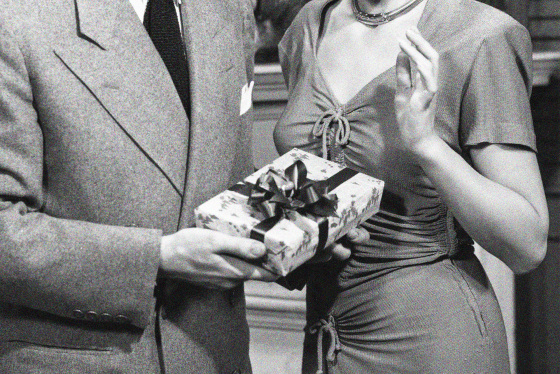 Couple exchanging Christmas gifts