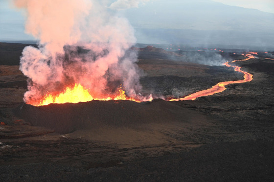 A helicopter view shows the Northeast Rift Zone fissure 3 vent and lava channel at the Mauna Loa Volcano near Hilo, Hawaii