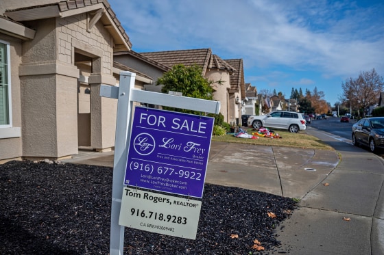 A "For Sale" sign in front of a home in Roseville, Calif., on Dec. 6, 2022. 