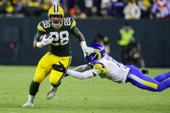 Green Bay Packers running back AJ Dillon is tackled after a catch by Los angles Rams cornerback Jalen Ramsey in Green Bay, Wis., on Dec. 19, 2022.