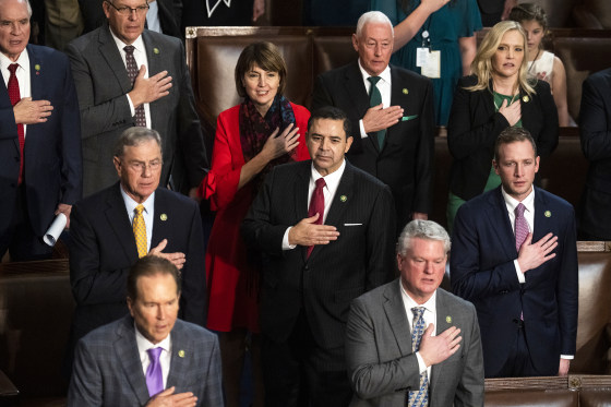 UNITED STATES - JANUARY 4: Reps. Henry Cuellar, D-Texas, center, Cathy McMorris Rodgers, R-Wash., and other members recite the Pledge of Allegiance before a vote on the House in which Republican Leader Kevin McCarthy, R-Calif., did not receive enough votes to become Speaker of the House, on Wednesday, January 4, 2023. (Tom Williams/CQ-Roll Call, Inc via Getty Images)