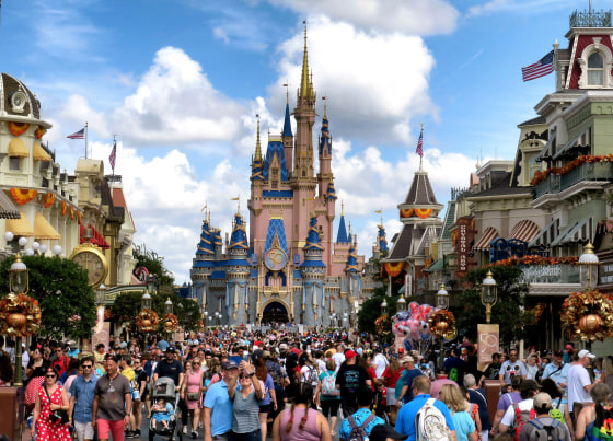 Crowds fill Main Street USA in front of Cinderella Castle at Walt Disney World in Lake Buena Vista, Fla., in 2021.