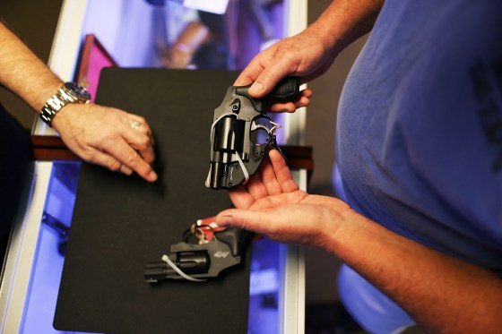 A customer shops for a handgun in Delray Beach, Fla., on Jan. 5, 2016.