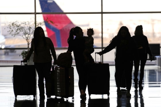 People pass through Salt Lake City International Airport on Jan. 11, 2023, in Salt Lake City.