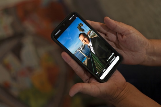 Ana Sandoval, mother of Eyvin Hernandez, shows a photo of Hernandez in Compton, Calif.