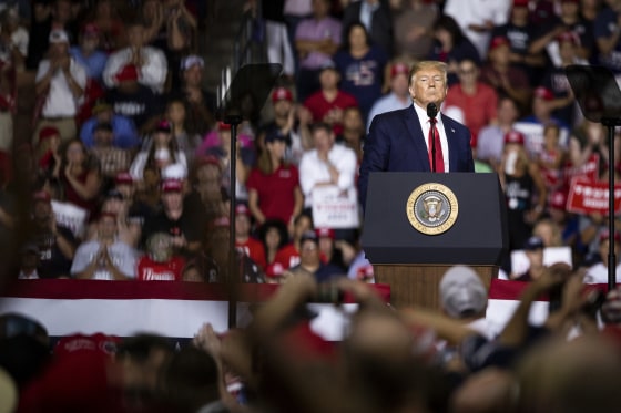 Then-President Donald Trump pauses during his speech at a rally in Manchester, N.H. on Aug. 15, 2019. 