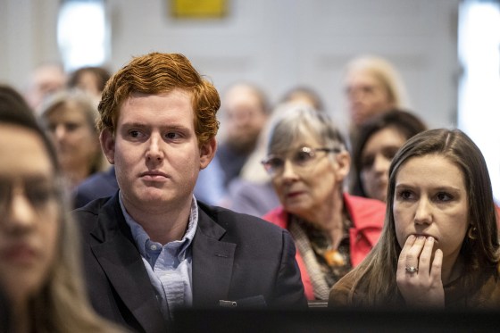 Buster Murdaugh, right, the son of Alex Murdaugh, listens to a