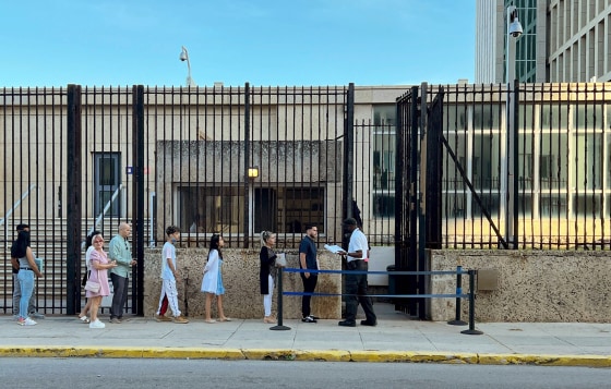 Cubans queue to enter the US embassy in Havana after full immigrant visa services for Cubans resumed