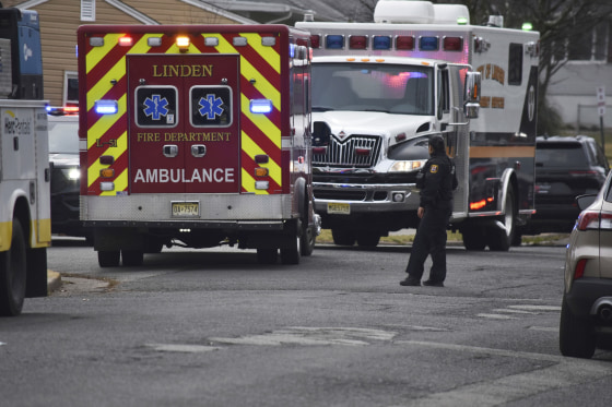 Emergency personnel work at the scene of a shooting in Linden, N.J.