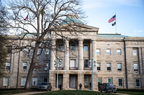 Law enforcement stand guard outside of the state capitol building in downtown Raleigh, N.C., on Jan. 17, 2021.