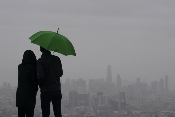 People look toward the skyline from Twin Peaks in San Francisco, Thursday, March 9, 2023. 
