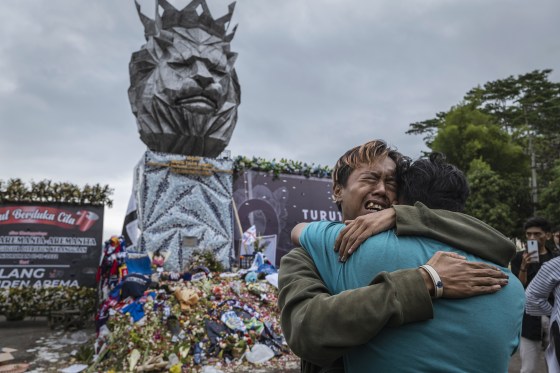 Relatives Grieve After Riot And Stampede At Football Match