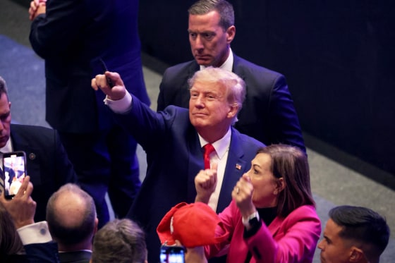 Former President Donald Trump greets guests following an event in Davenport, Iowa