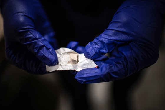 A police offers shows heroine/fentanyl that was part of a kit that a woman  was preparing to shoot inside a Walmart's bathroom on Sunday, February 10, 2019, in Manchester, NH.