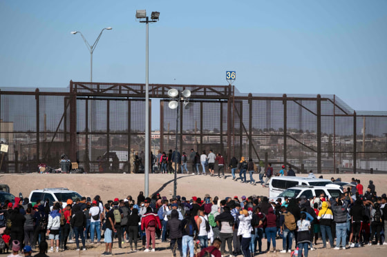 Migrants are processed by United States border patrol agents at the US-Mexico border in Ciudad Juarez, Mexico