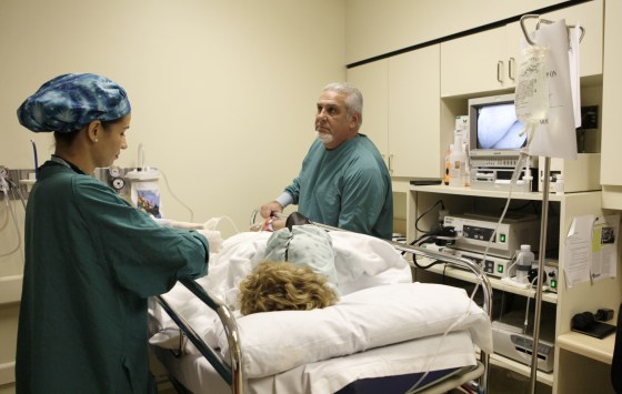 Dr. Pedro Jose Greer, right, prepares to do a colonoscopy at Mercy Hospital