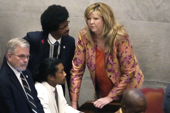 Rep. Justin Jones, D-Nashville, center, Rep. Justin Pearson, D-Memphis, back left and Rep. Gloria Johnson, D-Knoxville, huddle on the floor of the House chamber Thursday, April 6, 2023, in Nashville, Tenn. Tennessee Republicans are seeking to oust the three House Democrats for using a bullhorn to shout support for pro-gun control protesters in the House chamber. (AP Photo/George Walker IV)