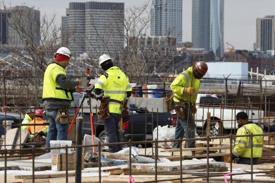 People work at a construction site in Boston