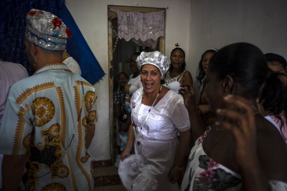 Maritza de la Rosa Perdomo, center, at a Santería ceremony in Havana on Nov. 13, 2022. 