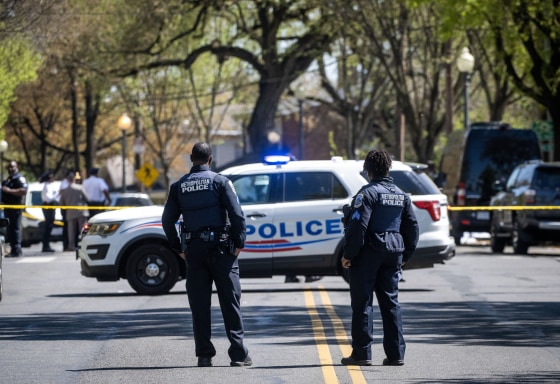 Police block the road at the scene of a shooting at Stewart Funeral Home