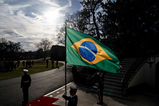 An honor guard holds Brazilian flag before President Joe Biden's meeting with Brazilian President Luiz Inacio Lula da Silva in Washington on Feb. 10, 2023.