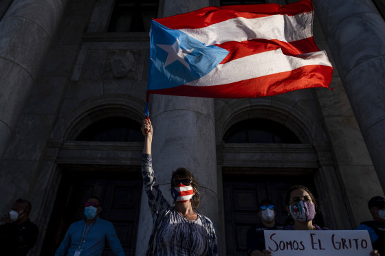 People rally on International Women's Day in San Juan, Puerto Rico, on March 8, 2021.