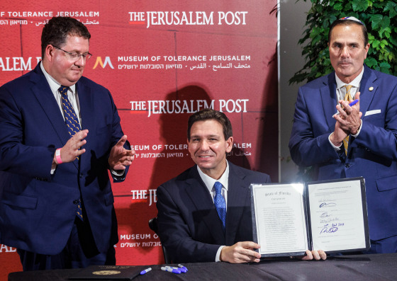 Florida Governor Ron DeSantis signs legislation to combat anti-Semitism during the Jerusalem Post Conference in Jerusalem on April 27, 2023.