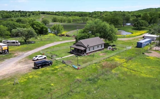 The crime scene where the bodies of seven people were found inside a home in Henryetta, Okla.