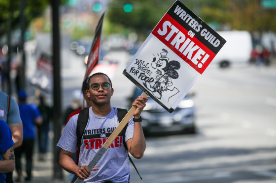 A T.V. writer joins Writers Guild of America strikers rally in front of Disney, Burbank, Calif., on May 10, 2023.