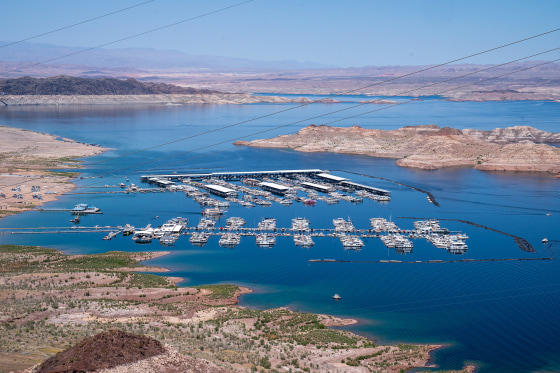 Boats docked along the shores of the Colorado River forming Lake Mead April 15, 2023 in Boulder City, Nev.
